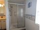 Modern glass-enclosed shower with updated fixtures and easy access at 1007 Forest Lake Dr, Lakeland, FL 33809