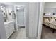 Stylishly remodeled bathroom leading to a bedroom at 1100 Martinique Dr # 202, Winter Haven, FL 33884