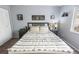 Inviting bedroom with a plush bed, side tables, and ample natural light at 1100 Martinique Dr # 202, Winter Haven, FL 33884
