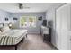 Comfortable bedroom with ceiling fan, natural light and closet at 1100 Martinique Dr # 202, Winter Haven, FL 33884
