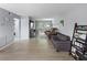 Inviting living room with gray walls, plank floors and an abundance of comfortable seating at 1100 Martinique Dr # 202, Winter Haven, FL 33884