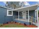 Cozy front porch featuring white railings and a freshly painted exterior at 1115 S Virginia Ave, Bartow, FL 33830