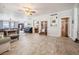 Open-concept living space with wood-look tile flooring and neutral paint at 112 E Graham Park Dr, Haines City, FL 33844