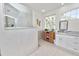 Bright bathroom featuring a glass-enclosed shower and granite vanity with drawers at 1134 Waterfall Ln # 66, Lakeland, FL 33803