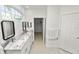 Clean bathroom featuring granite countertops and a double vanity at 1134 Waterfall Ln # 66, Lakeland, FL 33803