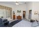 Sunlit bedroom boasts wood-look floors and access to an ensuite bathroom at 1134 Waterfall Ln # 66, Lakeland, FL 33803