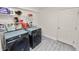 Bright laundry room featuring sleek, front loading washer and dryer and shelving for storage at 1134 Waterfall Ln # 66, Lakeland, FL 33803