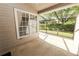 Covered screened patio that boasts great light and a scenic view of manicured landscape at 1134 Waterfall Ln # 66, Lakeland, FL 33803