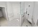 Accessible tiled shower features a seat and grab bar at 1134 Waterfall Ln # 66, Lakeland, FL 33803