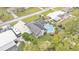 Overhead view of a single-story home featuring an in-ground pool, solar panels, and a hot tub at 1160 Ilene Ave, Bartow, FL 33830