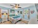 Cozy bedroom with soft blue walls, comfortable bed, and bright windows inviting natural light at 1160 Ilene Ave, Bartow, FL 33830