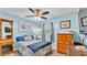 Inviting bedroom with blue walls, ceiling fan, and hardwood floors creating a relaxing retreat at 1160 Ilene Ave, Bartow, FL 33830