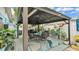 Covered gazebo with seating area and tropical decor at 1160 Ilene Ave, Bartow, FL 33830