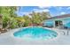 Backyard with a large swimming pool, lounge chairs, and hot tub at 1160 Ilene Ave, Bartow, FL 33830