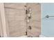 Shower with stylish gray tiling and convenient shower head fixture and hardware at 1160 Ilene Ave, Bartow, FL 33830