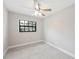 Bedroom featuring a window, neutral paint, ceiling fan, and carpeted flooring at 1180 E Hill Ct, Bartow, FL 33830