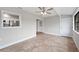 Bright dining room with tile floors, neutral walls, and access to the kitchen and outdoors at 1180 E Hill Ct, Bartow, FL 33830