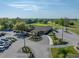 Aerial view of a clubhouse with parking and green space, highlighting its convenient location and well-maintained surroundings at 121 Greenfield Rd, Winter Haven, FL 33884