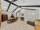 Bright dining room featuring exposed beams, tile floors, and decorative furniture, perfect for hosting gatherings at 121 Greenfield Rd, Winter Haven, FL 33884