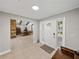 Welcoming foyer featuring tile flooring, a view to the dining area, and natural light at 121 Greenfield Rd, Winter Haven, FL 33884