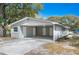 Attached two-car carport with multiple entry doors to the home at 1310 Walt Williams Rd, Lakeland, FL 33809