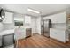 Well-lit kitchen featuring stainless steel appliances, subway tile, and white cabinets and countertops at 1310 Walt Williams Rd, Lakeland, FL 33809