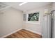 This utility room has wood-look vinyl floors and an electric water heater at 1310 Walt Williams Rd, Lakeland, FL 33809