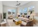 Bright and airy living room with large windows, plush seating, and modern decor, creating an inviting atmosphere at 13119 Granger Ave, Orlando, FL 32827