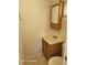 Bathroom featuring a sink with a vanity, mirror and a toilet at 1810 Blue Lake Dr, Lakeland, FL 33801