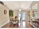 Bright dining room features tile floors, a modern light fixture, and sliding glass doors to a lanai at 2597 Highlands Vue Pkwy, Lakeland, FL 33812