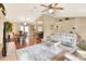 Spacious living area with tile flooring, neutral tones, and a seamless transition to the dining room and kitchen at 2597 Highlands Vue Pkwy, Lakeland, FL 33812