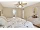 The primary bedroom features neutral paint, cozy carpet, and ensuite bath at 2597 Highlands Vue Pkwy, Lakeland, FL 33812