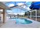 Inviting screened-in pool featuring a unique shape, providing the perfect spot for relaxation and recreation at 2597 Highlands Vue Pkwy, Lakeland, FL 33812