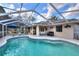 Beautiful screened-in pool and patio area, perfect for outdoor enjoyment and entertainment at 2597 Highlands Vue Pkwy, Lakeland, FL 33812