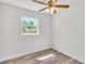 Bright bedroom with wood-look floors and a ceiling fan at 3035 Linda Dr, Lakeland, FL 33810