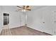 Bedroom featuring wood floors, ceiling fan and an en suite bathroom at 3035 Linda Dr, Lakeland, FL 33810