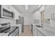 Kitchen view showcasing stainless steel appliances, white cabinets and light countertops at 3035 Linda Dr, Lakeland, FL 33810