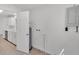 View of utility room showing water heater and access to the kitchen area at 3035 Linda Dr, Lakeland, FL 33810