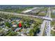 An aerial view shows the home's proximity to major roads, retail, and the surrounding neighborhood at 3823 Woodburn E Loop, Lakeland, FL 33813