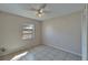 Bedroom featuring a ceiling fan, neutral walls and tiled floor at 3823 Woodburn E Loop, Lakeland, FL 33813