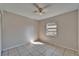 Bedroom with tile floor, ceiling fan, and a window providing natural light at 3823 Woodburn E Loop, Lakeland, FL 33813