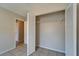 Open closet with wire shelving and doors next to a door leading into another room at 3823 Woodburn E Loop, Lakeland, FL 33813