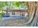 A cozy screened-in porch offers a relaxing space to enjoy the backyard views and the beauty of the outdoors at 3823 Woodburn E Loop, Lakeland, FL 33813