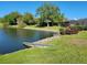 Scenic backyard featuring waterfront views and lush landscaping at 4025 Cheverly E Dr, Lakeland, FL 33813