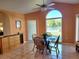 Dining area showcasing a window view and a black dining table with wood chairs at 4025 Cheverly E Dr, Lakeland, FL 33813