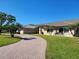 Circular brick driveway providing ample parking and enhancing the curb appeal at 4025 Cheverly E Dr, Lakeland, FL 33813