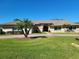 Charming home featuring a lush lawn, mature landscaping, and a welcoming circular driveway at 4025 Cheverly E Dr, Lakeland, FL 33813