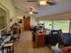 Spacious home office with tile flooring, lots of natural light, and multiple ceiling fans at 4025 Cheverly E Dr, Lakeland, FL 33813