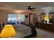 Cozy main bedroom featuring a ceiling fan, dresser, and natural light at 4025 Cheverly E Dr, Lakeland, FL 33813