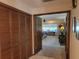 View of the main bedroom from the hallway featuring a cozy sitting area and large windows at 4025 Cheverly E Dr, Lakeland, FL 33813